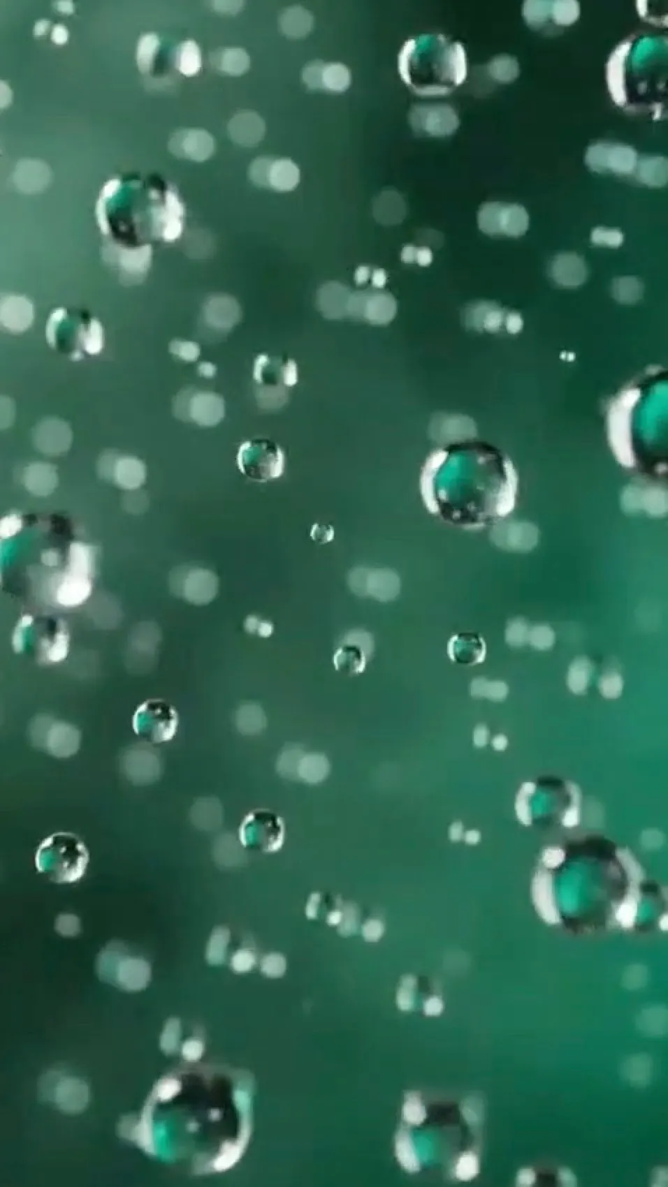 Macro shot of green bubbles from the AI product video
